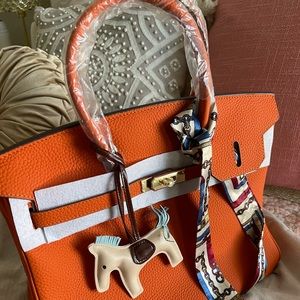 Orange top handle satchel leather type bag